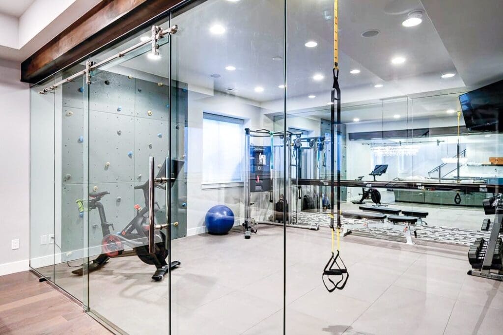glass door home gym | inside rock wall