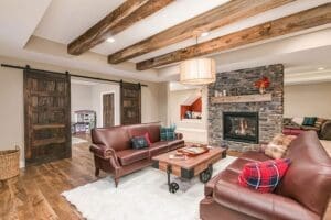 basement remodel with stone wall fireplace