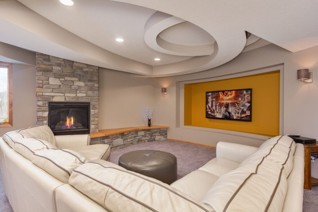 basement | orange accent wall | cream furniture