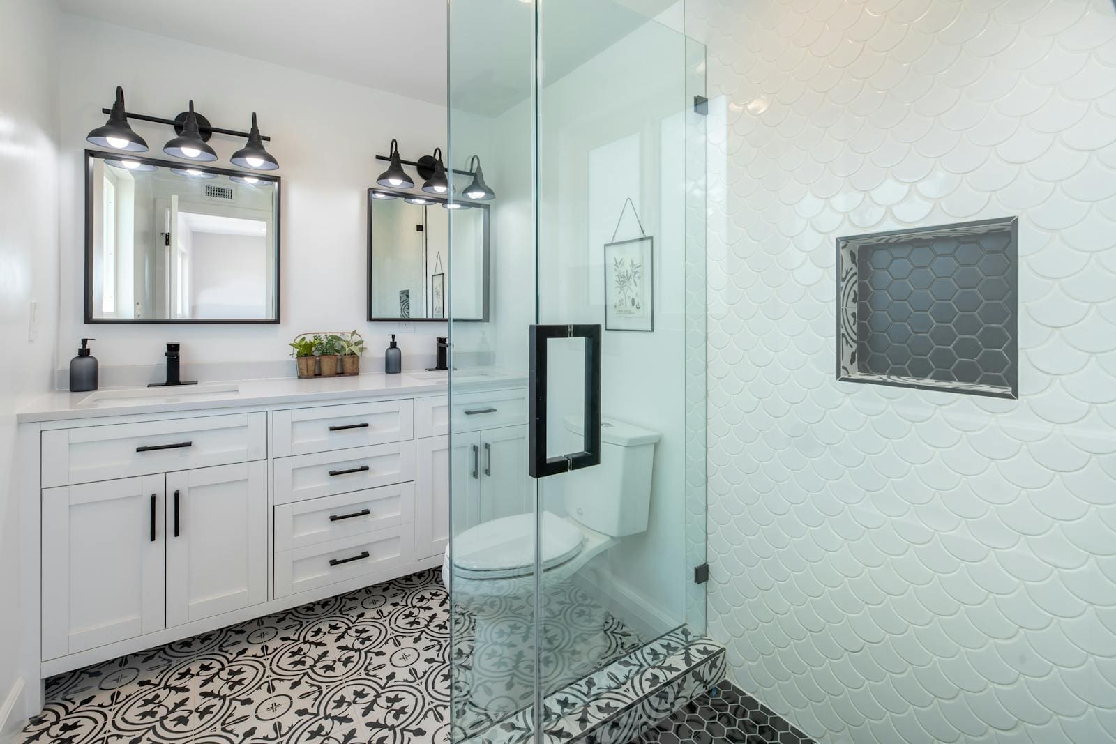 A small bathroom with painted wooden cabinets.